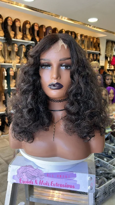 Human - hair wig with a wispy fringe for a soft and feminine lookJune Curly