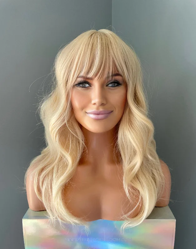 Bob wig with a curly fringe for a playful and youthful vibe"Kate" - Layered Blonde Wig with Bangs